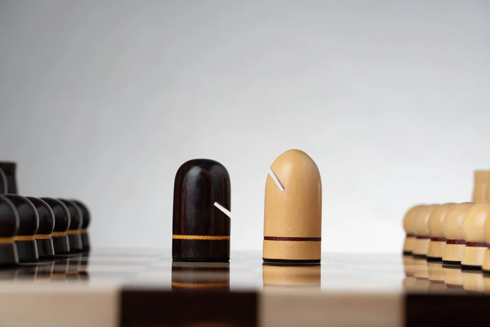 Hand-painted Maldivian chess set with illustrated luxury board and culturally inspired chess pieces, handcrafted in England by Geoffrey Parker.