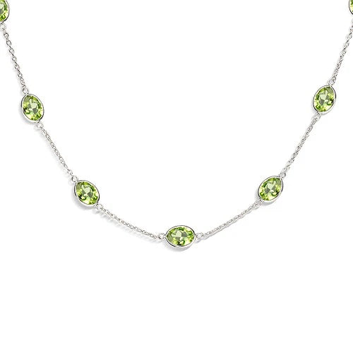 18ct white gold necklace with twelve oval peridot gemstones by Deakin & Francis at EB London