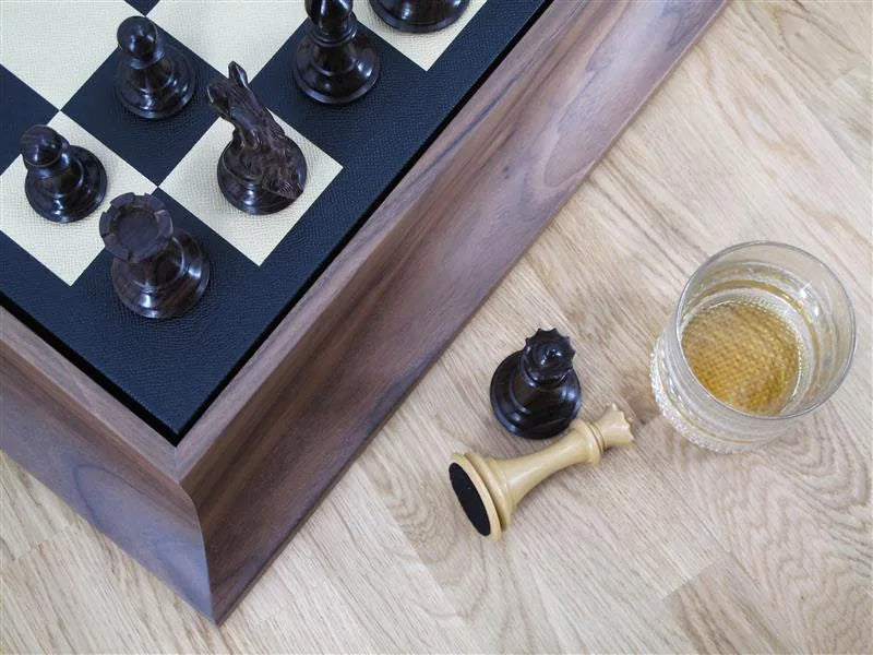 Luxury wooden chess set with walnut plinth, hand-inlaid magnolia and ebony board, and triple-weighted hand-carved pieces by Geoffrey Parker for EB London.