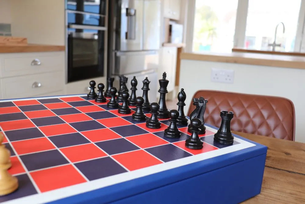 Luxury chess set with printed leather playing surface, Cobalt Blue plinth board, and triple-weighted Staunton chessmen by Geoffrey Parker for EB London.