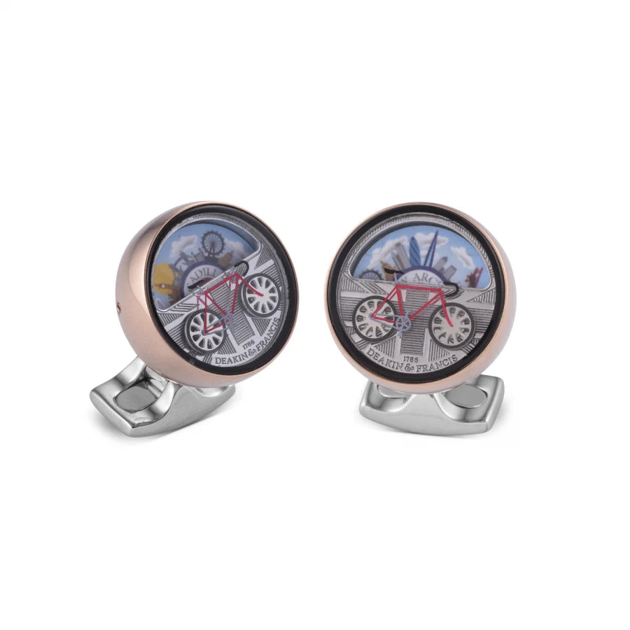 London moving scene cufflinks with spinning bicycle wheels and city backdrop by Deakin & Francis at EB London