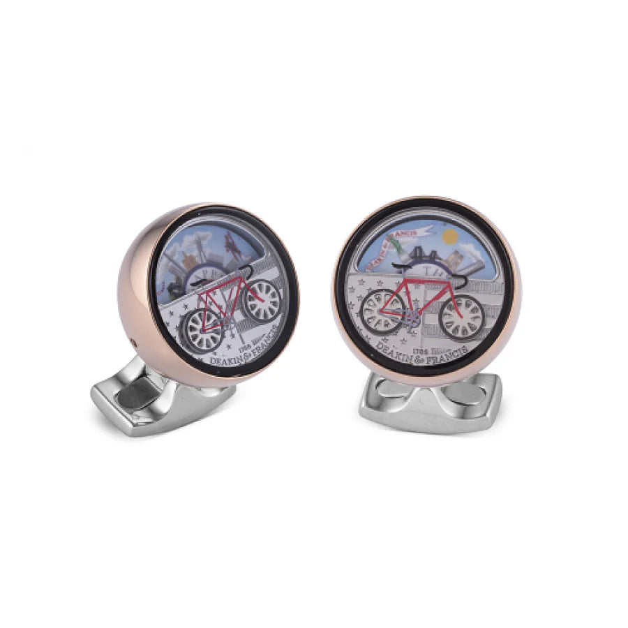 New York moving scene cufflinks with spinning bicycle wheels and city backdrop by Deakin & Francis at EB London