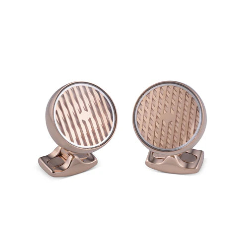 Rose gold kinetic cufflinks with concealed gravity-propelled rotating disc and etched line pattern by Deakin & Francis at EB London