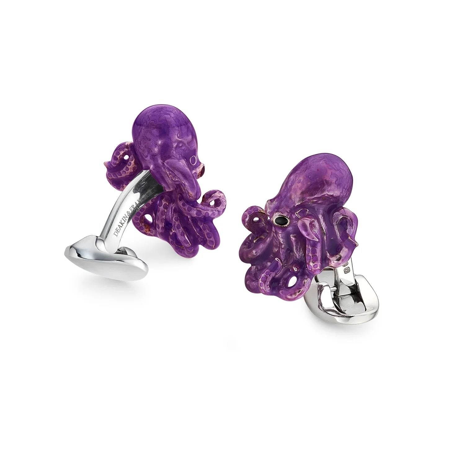 Purple octopus cufflinks on a white background